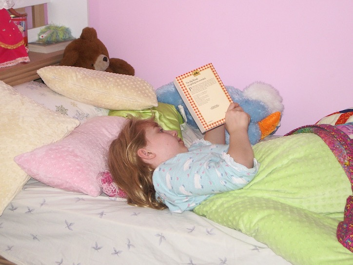Katie reading in bed